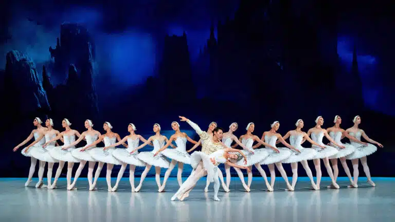 ballet dancers on stage performing swan lake