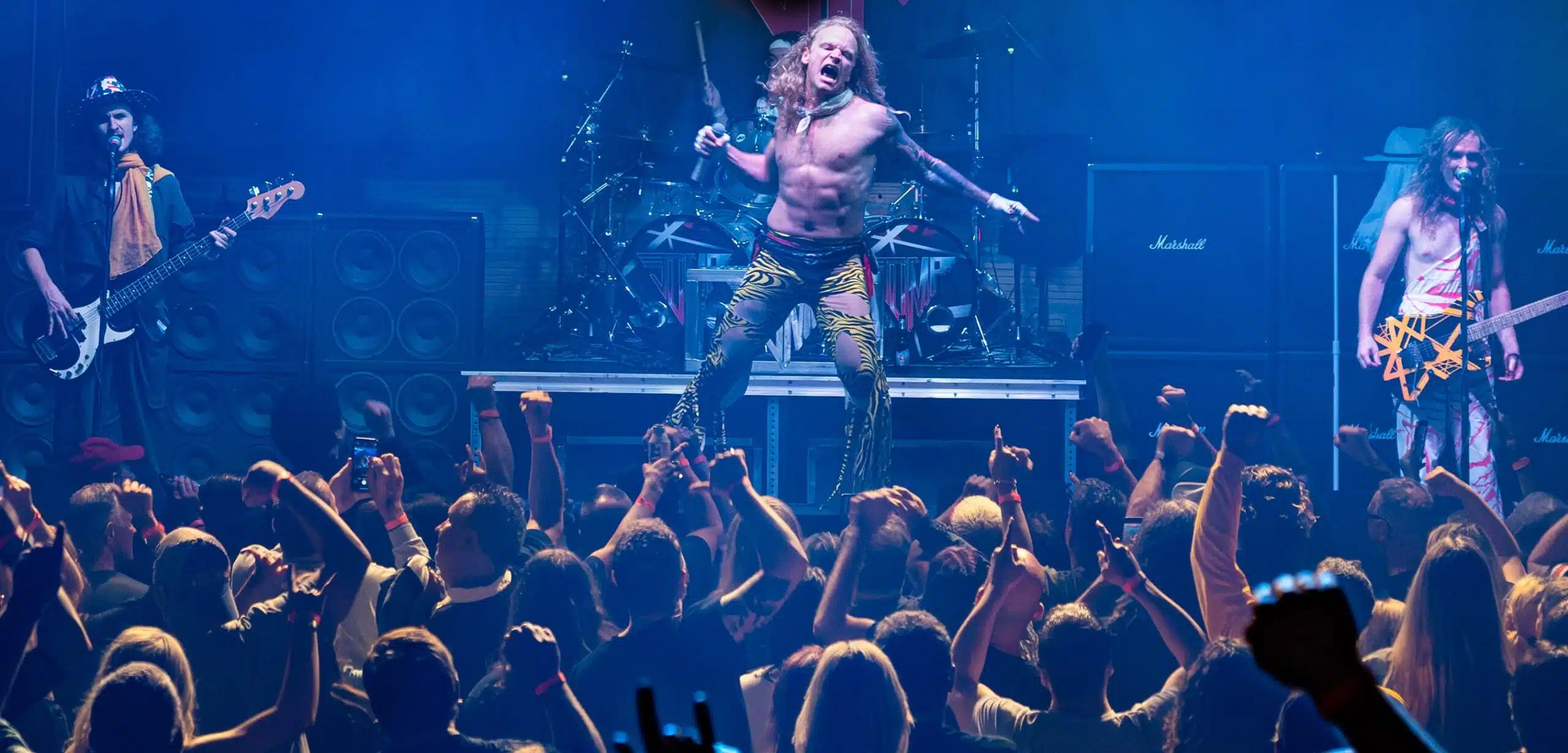 Van Halen tribute band playing on stage in front of crowd