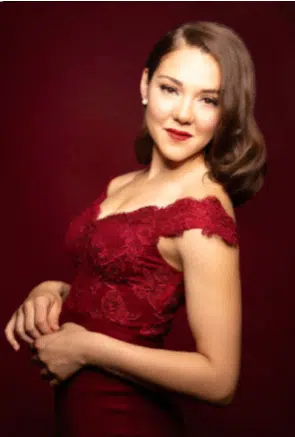 Women in red dress smiling at camera