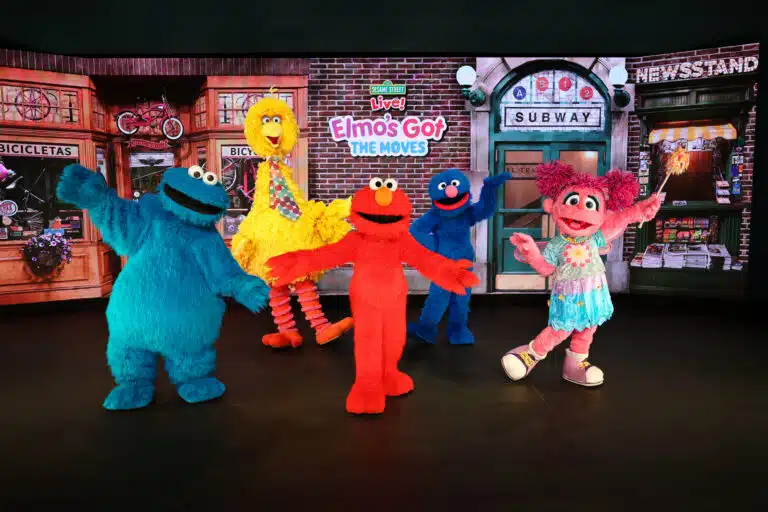 photo of Sesame Street characters Cookie Monster, Big Bird, Elmo, and Abby