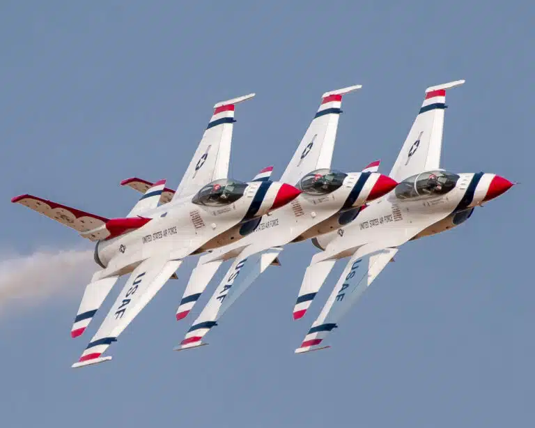 photo of 3 USAF Thunderbirds flying in formation