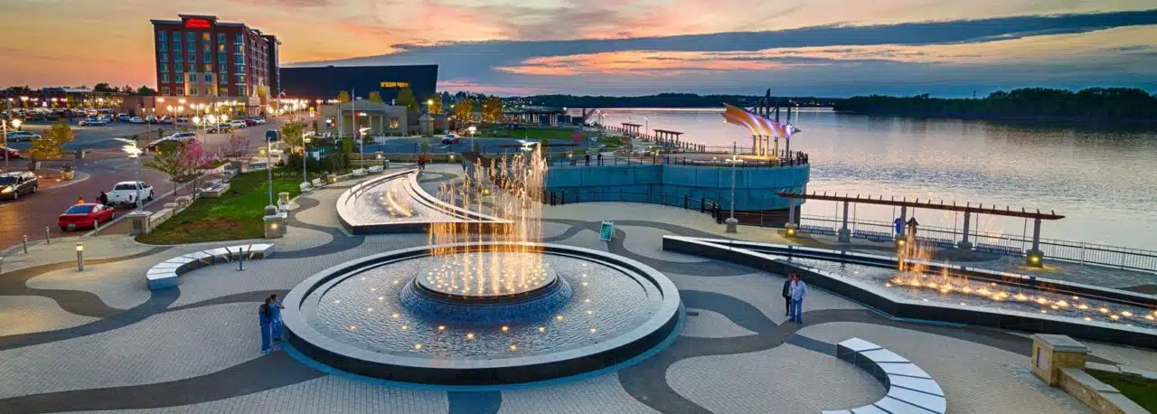 An aerial view of downtown owensboro featuring the fountains at Smothers Park