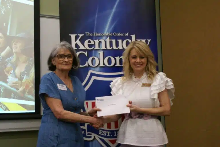Director of Development Jennifer Richardson accepting the award