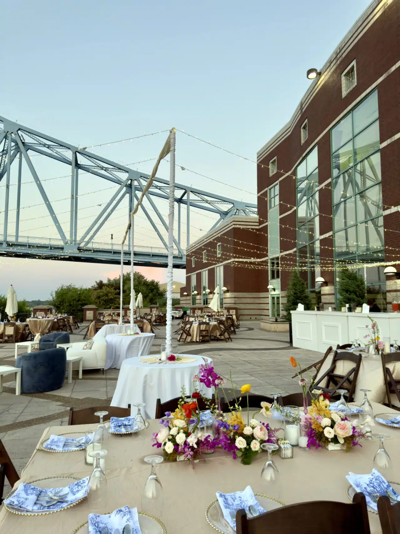 Colorful florals highlight a table setting for a wedding on the RiverPark Center patio