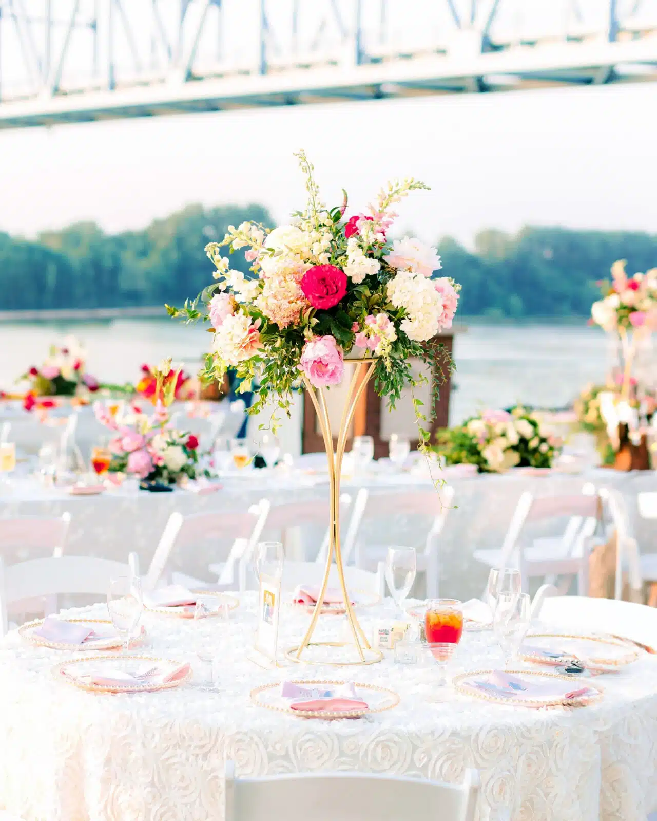 A beautiful floral centerpiece and table setting for a RiverPark Center Plaza wedding reception