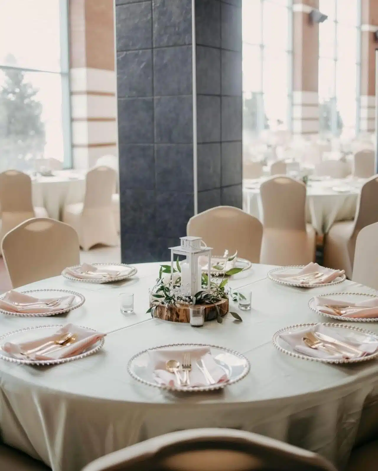 A beautiful table setting for a wedding in the RiverPark Center Lobby.